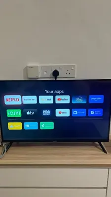 a tv sitting on top of a wooden table at StudioMimi Near UTP UiTM Seri Iskandar in Seri Iskandar