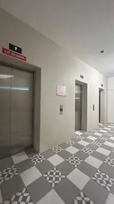 a lobby with a checkered floor in a building at StudioMimi Near UTP UiTM Seri Iskandar in Seri Iskandar