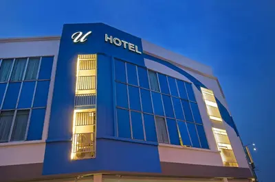 a blue building with a hotel sign on it at U Design Hotel Bukit Mertajam in Bukit Mertajam