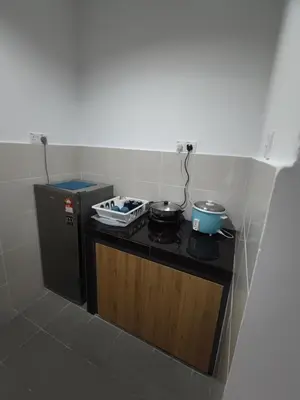 a small kitchen with a stove with pots and pans at CAMERON HIGHLAND CENRTUM BRINCHANG Homestay By Dcozy 6-7pax in Brinchang