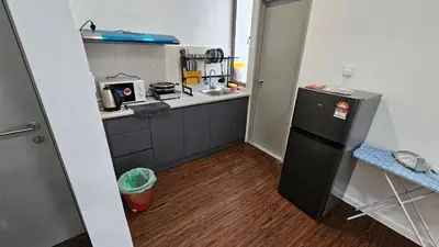 a small kitchen with a refrigerator and a sink at CAMERON HIGHLAND BRINCHANG KEA FARM Homestay By Dcozy 6-7pax in Brinchang