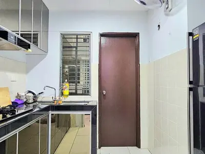 a kitchen with a brown door in a kitchen at Warm Nest Condo 9\u697c\u6e29\u99a8\u5c0f\u5c4b in Sekincan