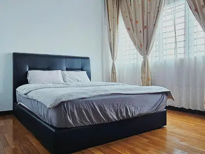 a bed in a bedroom with a large window at Warm Nest Condo 9\u697c\u6e29\u99a8\u5c0f\u5c4b in Sekincan