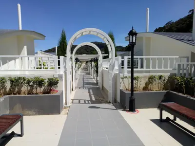 an archway with a bench and a street light at COOL Stay Cameron Golden Hills in Brinchang