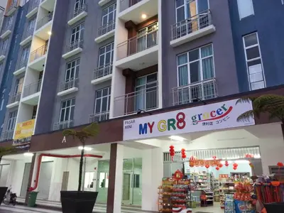 a building with a sign in front of a store at COOL Stay Cameron Golden Hills in Brinchang