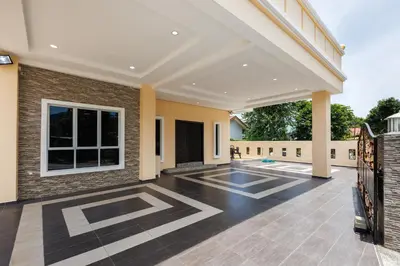 an empty patio of a house with a brick wall at Comfy Bungalow Family House Pg Hill & Kek Lok Si in Ayer Itam