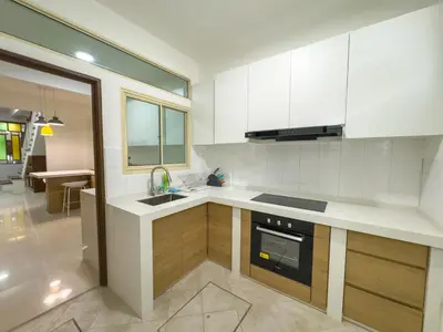 a kitchen with a sink and a stove top oven at Gracious Green Gurney in George Town