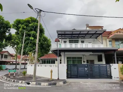 a white house with a blue gate in front of it at Leisure Homestay BM in Bukit Mertajam