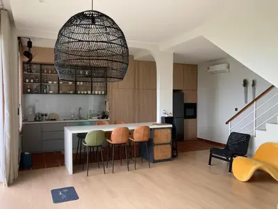 a kitchen with a table and some chairs in a room at Mega Seaview Escape - Butterworth Penang in Butterworth