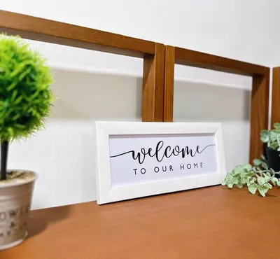 a welcome to our home sign on a table at Maple Home BM in Bukit Mertajam