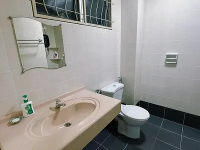 a bathroom with a sink and a toilet at Maple Home BM in Bukit Mertajam