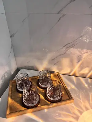 a tray with four glass jars on a table at Pantai Remis 116 Minsu Homestay in Pantai Remis