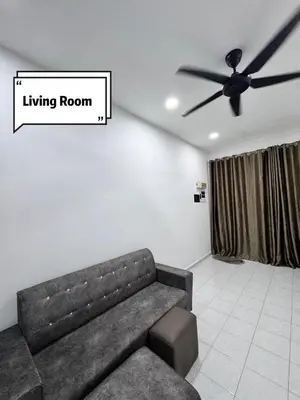 a living room with a couch and a ceiling fan at Pantai Remis 116 Minsu Homestay in Pantai Remis