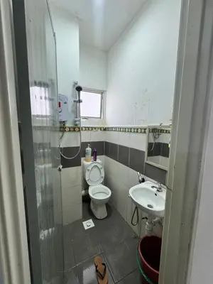 a bathroom with a toilet and a sink at AYAAN HOMESTAY Tanah Rata with Netflix in Tanah Rata