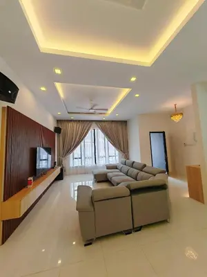 a living room with a couch and a television at Ipoh M Villa in Ipoh