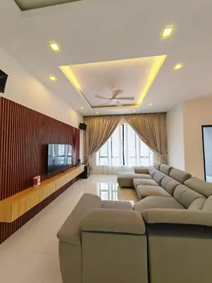 a waiting room with couches and a flat screen tv at Ipoh M Villa in Ipoh