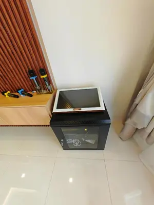 a tv sitting on a shelf in a room at Ipoh M Villa in Ipoh