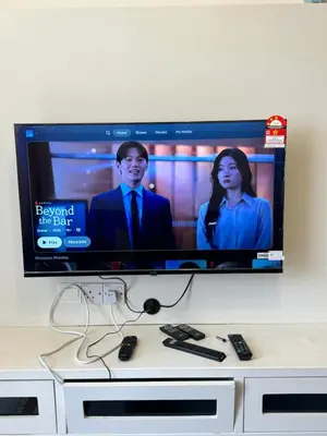 a flat screen tv sitting on top of a table at AYAAN Prima Homestay 1 with Netflix in Tanah Rata