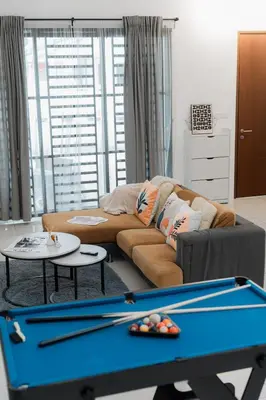 a living room with a couch and a pool table at VibeHaus Snooker SimpangAmpat ``` 4Room10Pax3Bath in Simpang Ampat