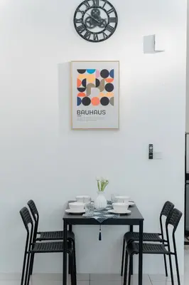 a black table with chairs and a clock on the wall at VibeHaus Snooker SimpangAmpat ``` 4Room10Pax3Bath in Simpang Ampat