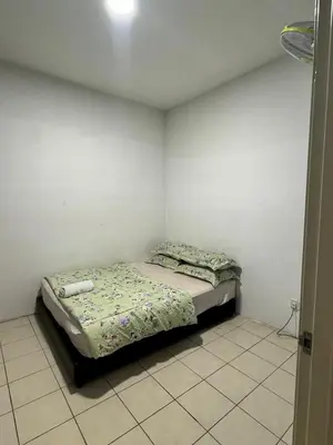a small bedroom with a bed in the corner at AYAAN Budget Homestay at Tanah Rata in Tanah Rata