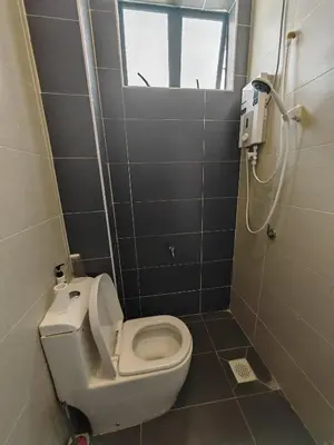 a small bathroom with a toilet and a shower at Ipoh M Villa 2 in Ipoh