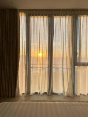 a room with a window with a view of the ocean at Seaview Master Room - Ensuite Bath in Butterworth in Butterworth