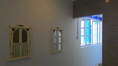 a room with two windows and a white wall at Fastbook Sun Moon City Home 12Pax in Ayer Itam