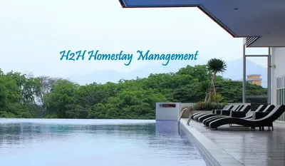 a swimming pool with chairs next to the water at H2H - Majestic A19 stay station - 5pax in Ipoh