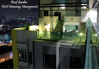 a view of a building with a balcony at night at H2H - Majestic A19 stay station - 5pax in Ipoh