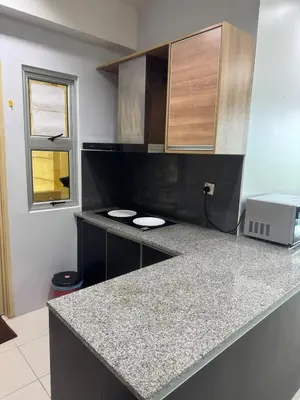a kitchen with a counter with two toilets on it at 2Bedroom Condo at Cinta Sayang Resort in Sungai Petani