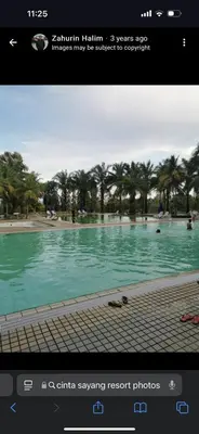 a screenshot of a picture of a swimming pool at Premium Condo at Cinta Sayang Club in Sungai Petani