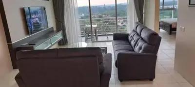 a living room with two couches and a television at Premium Condo at Cinta Sayang Club in Sungai Petani