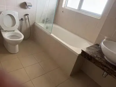 a bathroom with a toilet and a tub and a sink at Premium Condo at Cinta Sayang Club in Sungai Petani