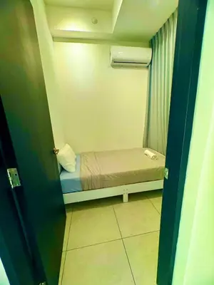 a small bedroom with a small bed in a room at urban suites 3 bedroom 10pax a29 in Jelutong