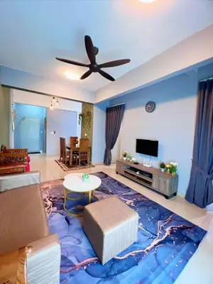 a living room with a couch and a ceiling fan at Gambus Sireh Homestays in Tanah Rata