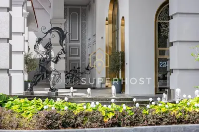 a statue in front of a building at 22 Macalisterz by YourSuperhost in George Town