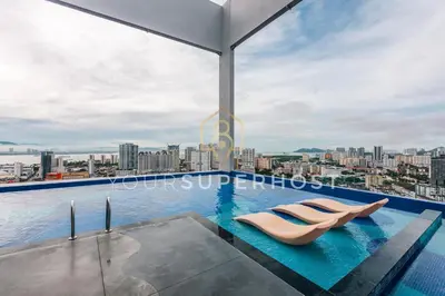 a swimming pool on the roof of a building at 22 Macalisterz by YourSuperhost in George Town