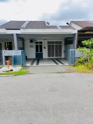 a white house with a fire hydrant in front of it at Homestay Rumahku Jana in Kamunting