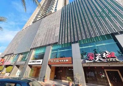 a tall building with a lot of windows on it at Harborlight Jazz Suite in Tanjong Tokong
