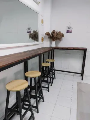 a row of stools at a bar in a restaurant at Fz North Meru Impian in Ipoh
