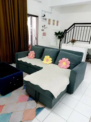 a living room with a couch with flowers on it at Fz North Meru Impian in Ipoh