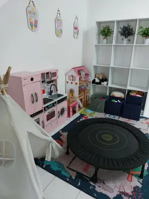a room with a play kitchen with a play table at Fz North Meru Impian in Ipoh