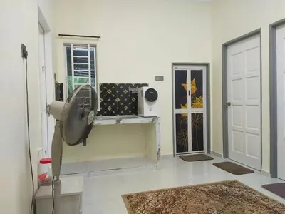 a white room with a fan and a door at Teratak Desa Cemerlang 2 in Kuala Kangsar