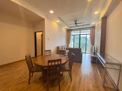 a living room with a table and chairs and a couch at Nova Homestay Cameron Highlands in Brinchang
