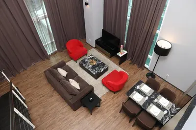 an overhead view of a living room with red furniture at Urbano Luxury Homestay at Maritime in George Town