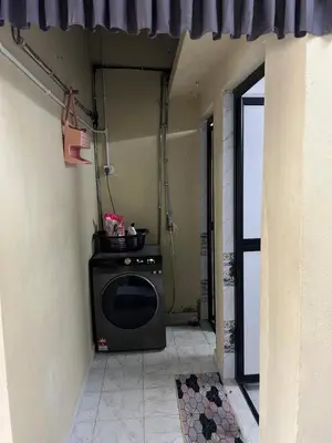 a room with a stove in the corner of a building at laman terrace stays in Sungai Petani