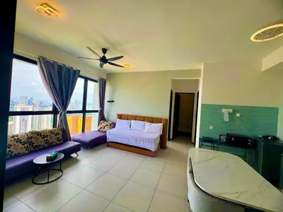 a bedroom with a bed and a couch in a room at urban suites 3BR 10pax b30 infinity pool in Jelutong