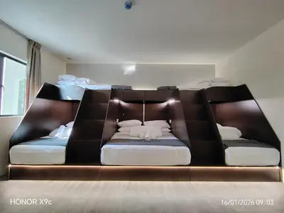 a bed in a room with two mattresses at The Great Hotel Sri Iskandar in Seri Iskandar