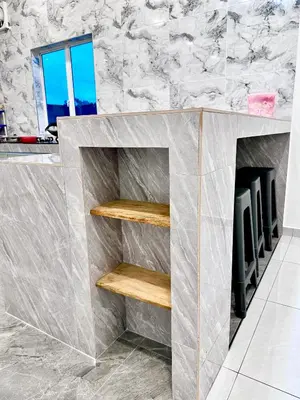 a gray counter with wooden shelves in a room at \u9003\u79bb\u57ce\u5e02 mumu home in Gopeng